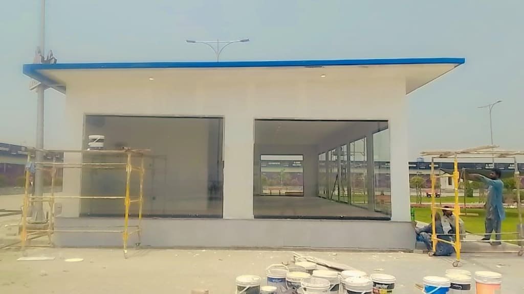 a building with a ladder and buckets